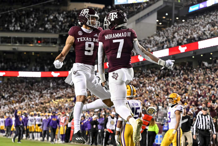 Texas A&M football players celebrate a touchdown.
